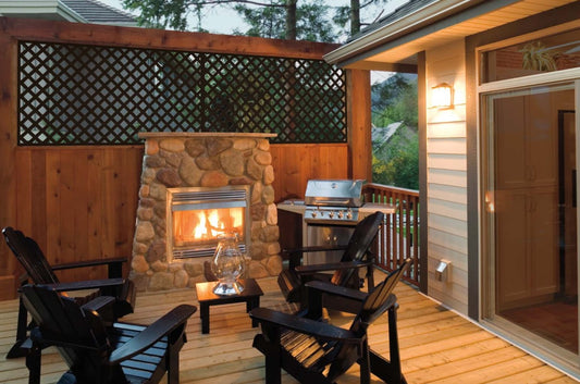 Deckorators lattice panels around a backyard patio with a fireplace