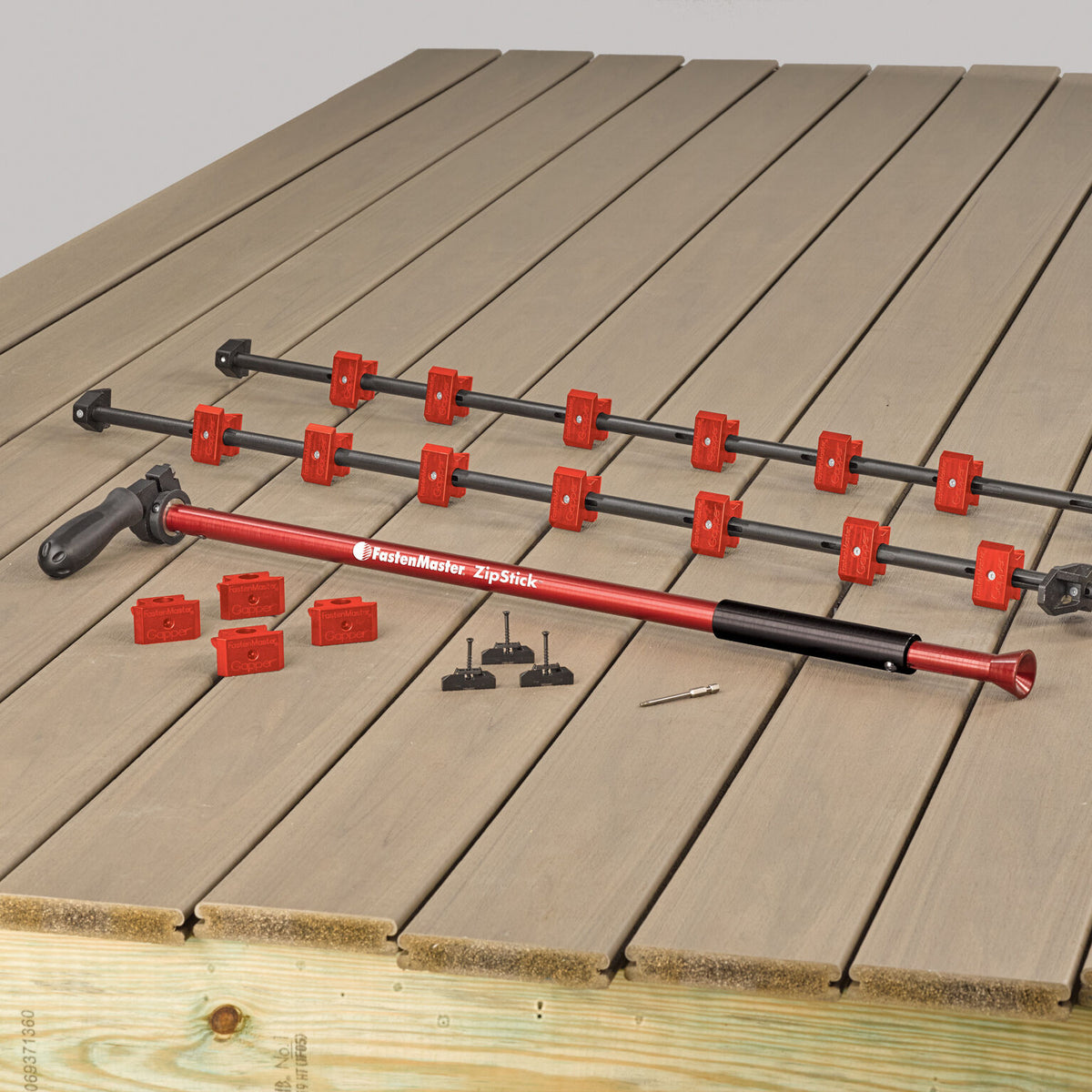 FastenMaster Zip System gappers, rods and Zip Stick laid out on a deck