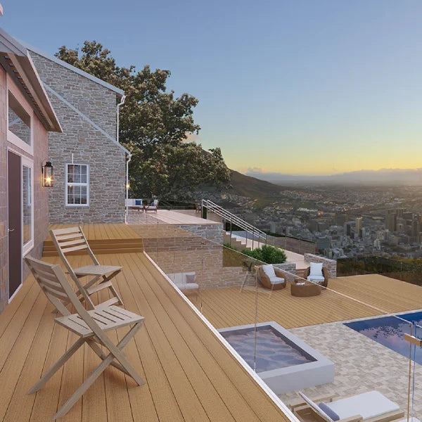 MoistureShield Meridian deck overlooking cityscape, featuring golden-hued decking, poolside seating, and mountain views.