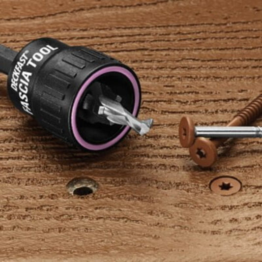 Drill driving a Cap-Tor xd screw into brown composite decking