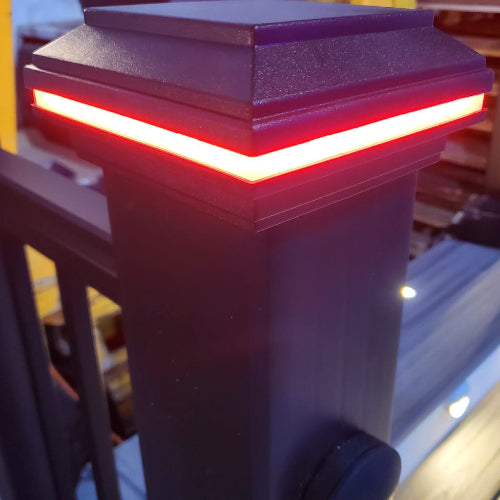 Tru-Scapes LED post light glowing red on a black post