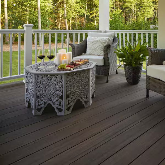 Deck with TimberTech Landmark boards, white railing, patterned side table and chairs