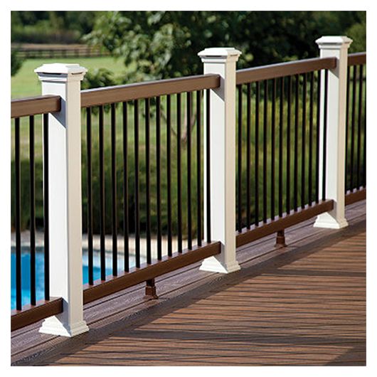 Poolside deck with white Trex Transcend posts, brown rails and black balusters