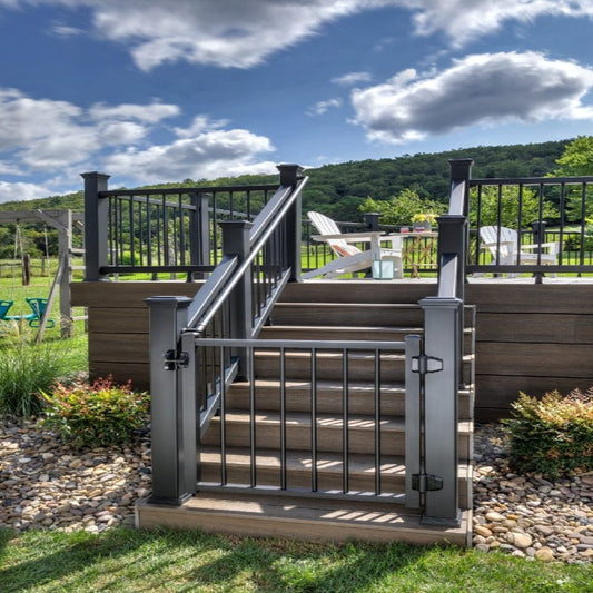 Deck stairs with black Trex Signature aluminum railing and gate