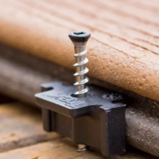 Trex Hideaway hidden fastener installed in the groove of a deck board on a joist