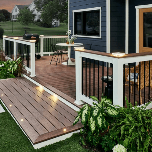 Backyard deck with Wolf Serenity Rosewood decking and white rail with deck board top cap