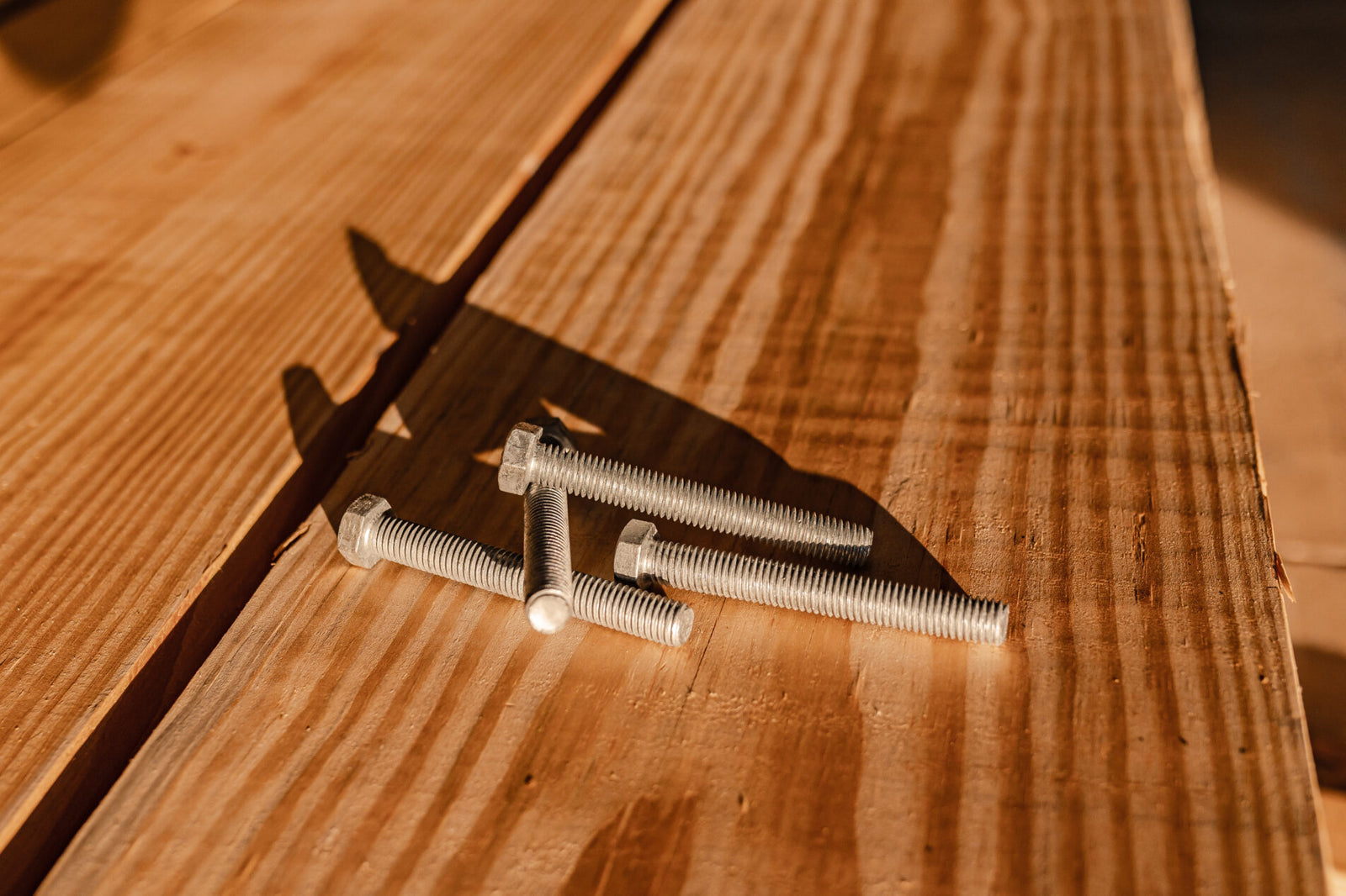 bolts on a wooden desk