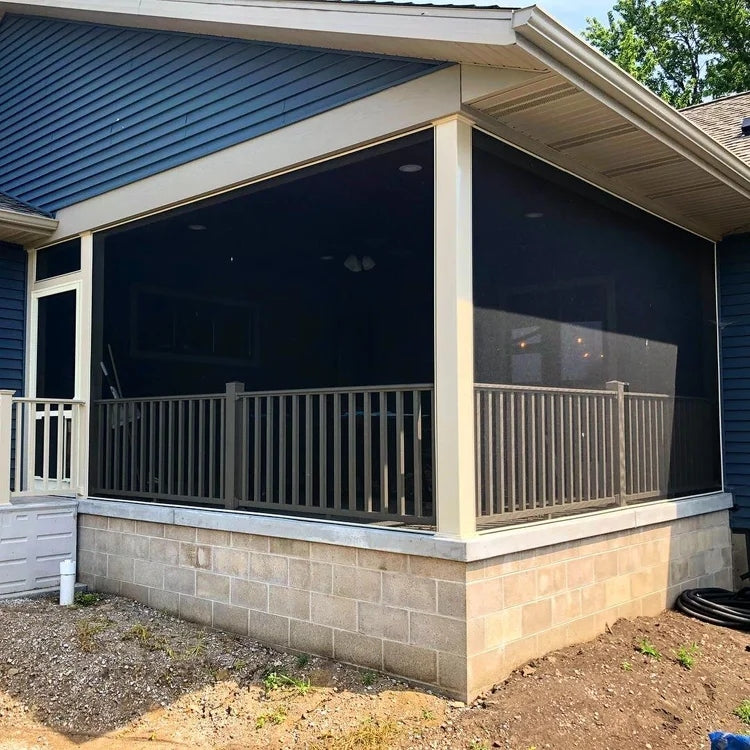 Screened porch on a blue house using Phifer TuffScreen