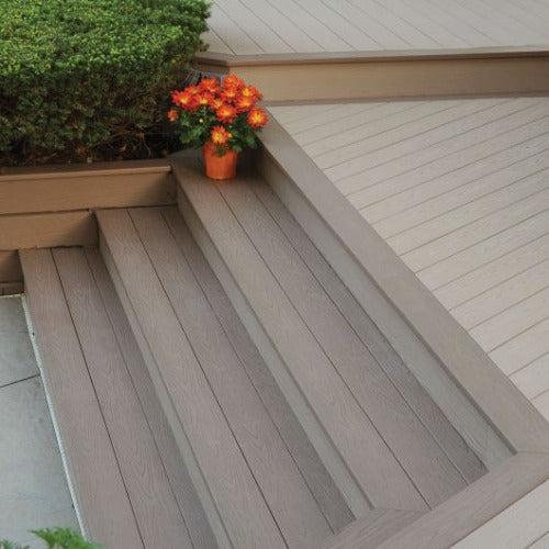 Close-up of deck steps with TimberTech Harvest fascia and riser boards