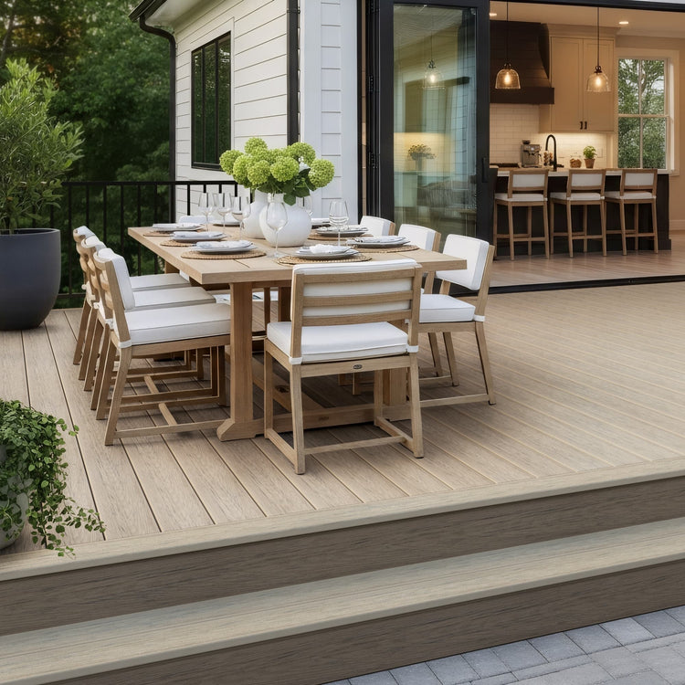 Outdoor dining setup on a wooden deck with chairs and a table.