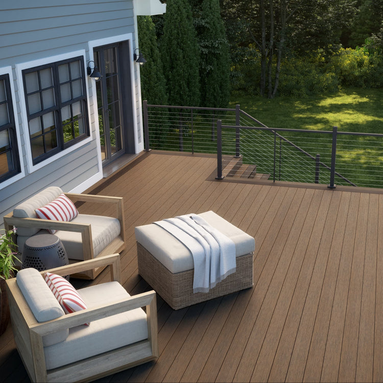 Outdoor deck with wooden furniture and a view of a house and garden.
