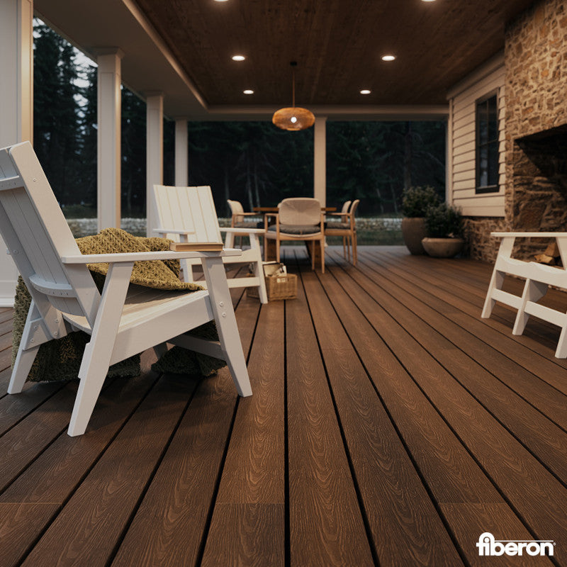 Wooden deck with outdoor furniture and a stone fireplace, featuring the brand 'fiberon'.