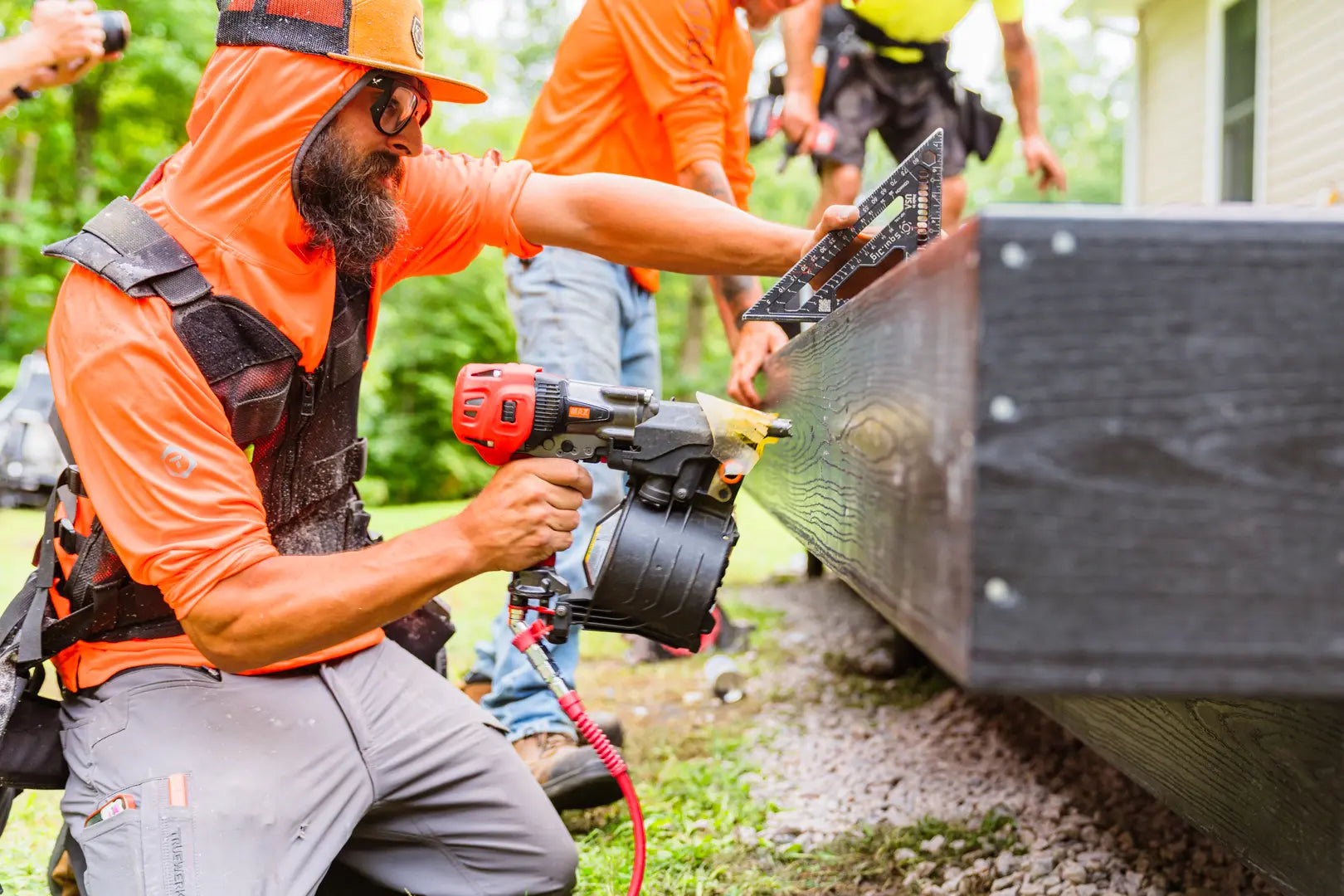 Person using a power drill on a construction site