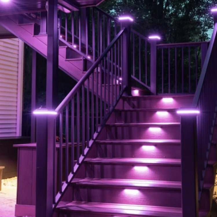 Staircase with purple LED lights on a deck at night