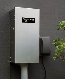 Tru-Scapes stainless steel transformer mounted on an exterior wall