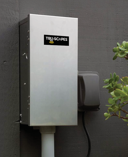 Tru-Scapes stainless steel transformer mounted on an exterior wall