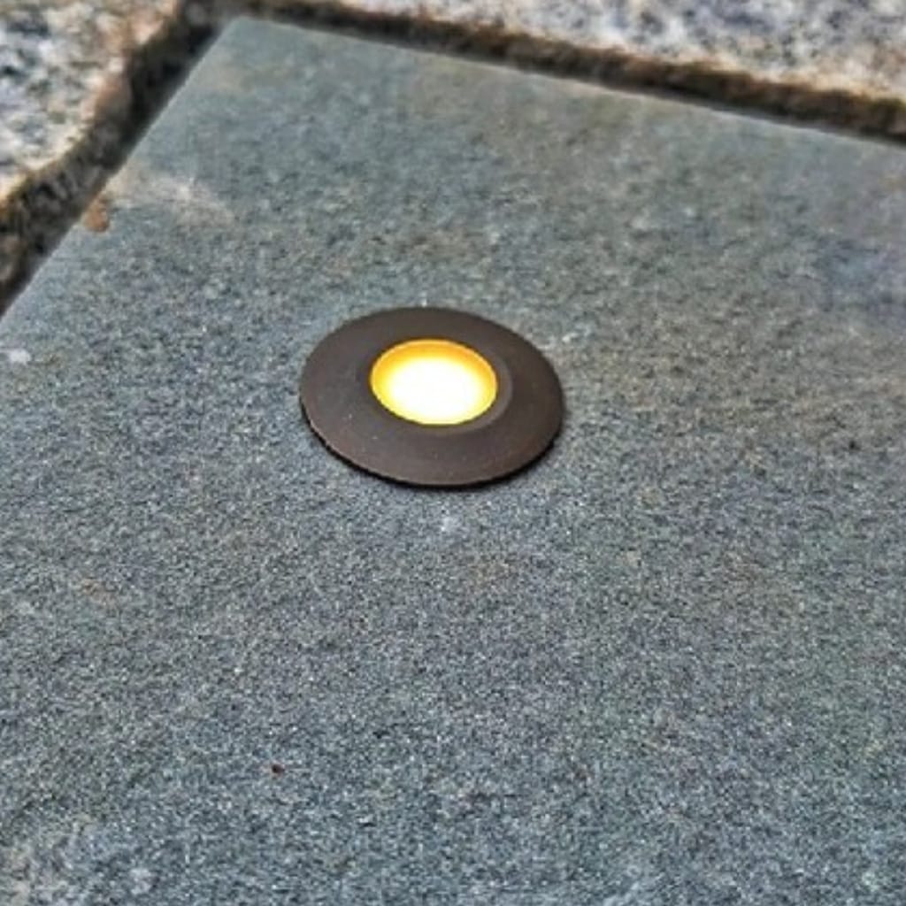 Round LED light embedded in a concrete surface