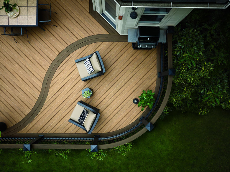 Top-down view of a patio with outdoor furniture and a pool area.
