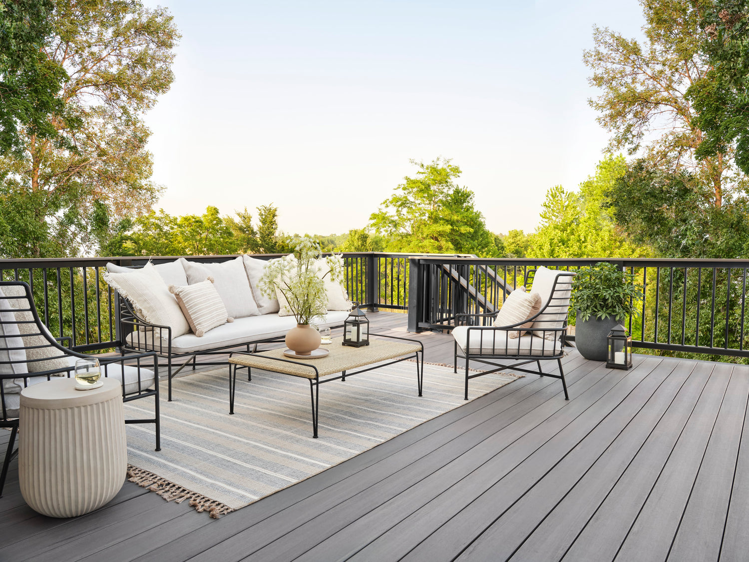 Outdoor patio with furniture and decor on a wooden deck