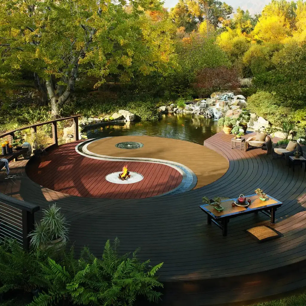 Circular Trex deck with a yin-yang design, featuring a fire pit and seating areas